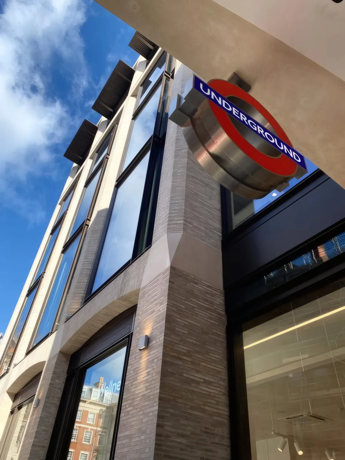 Detail of the building’s stone and aluminium-clad soffit at street level.