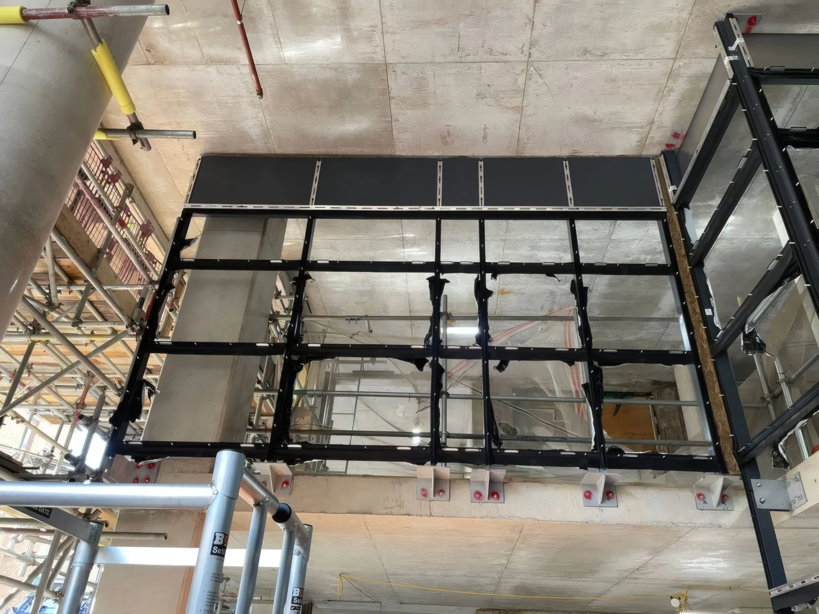 Structural steelwork for the curtain wall grid.