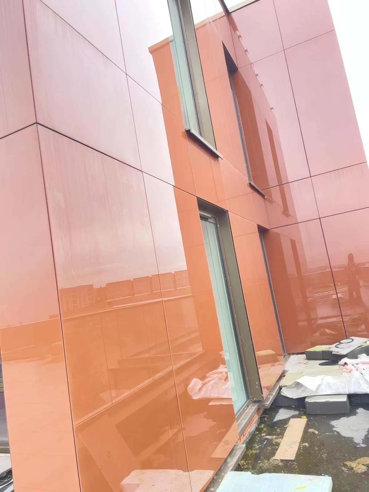 A completed run of feature aluminium cladding panels to a balcony corner.